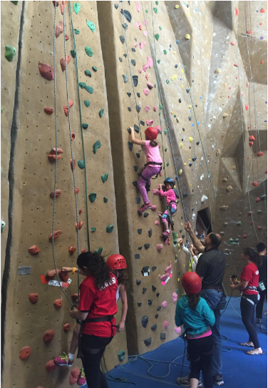 Emily Judith Mitnick celebrates her birthday in the climbing gym with her friends.