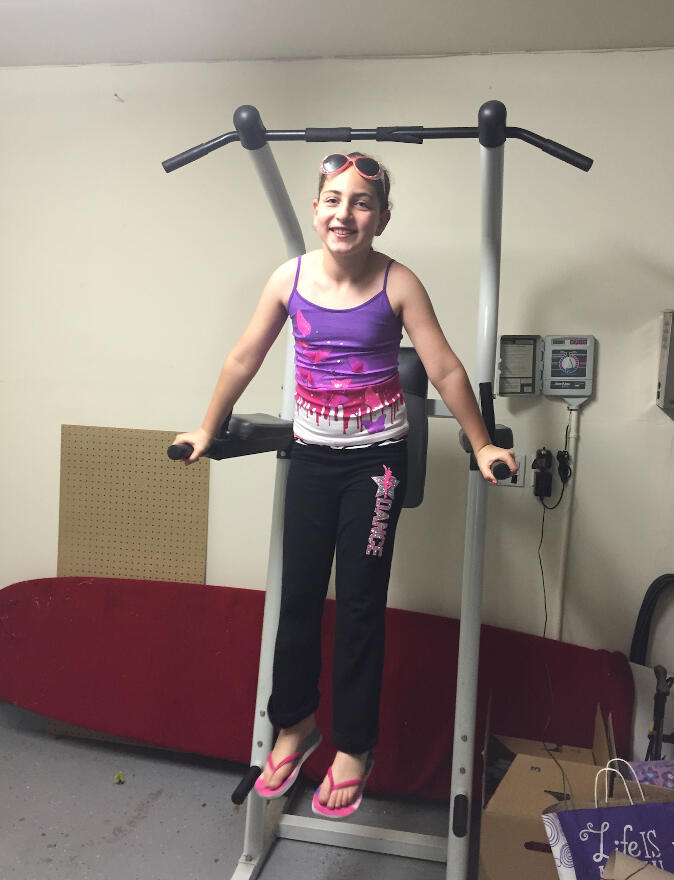 Emily Mitnick is gaining strength and confidence in using exercise equipment.