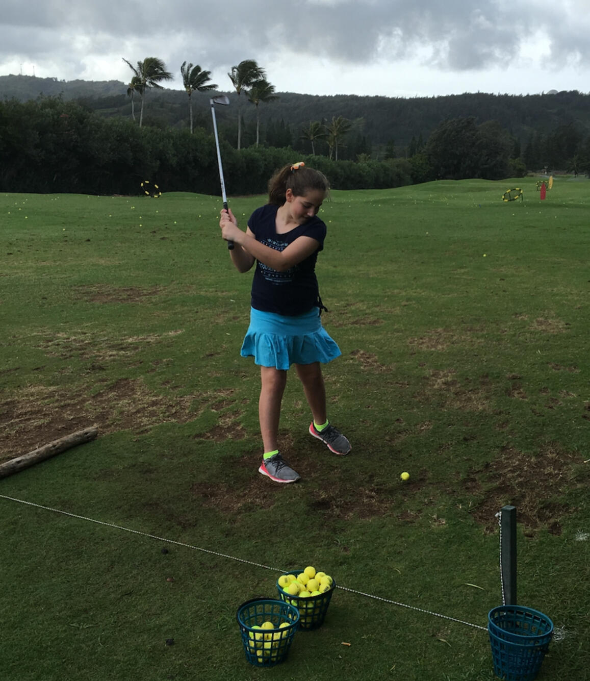 Emily Mitnick is practicing basic golfing skills at the rezort.