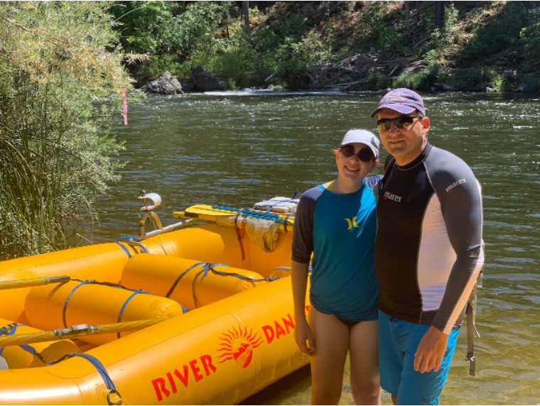 Emily Minick is happy to take another colorful picture with yellow raft and the river on the background.